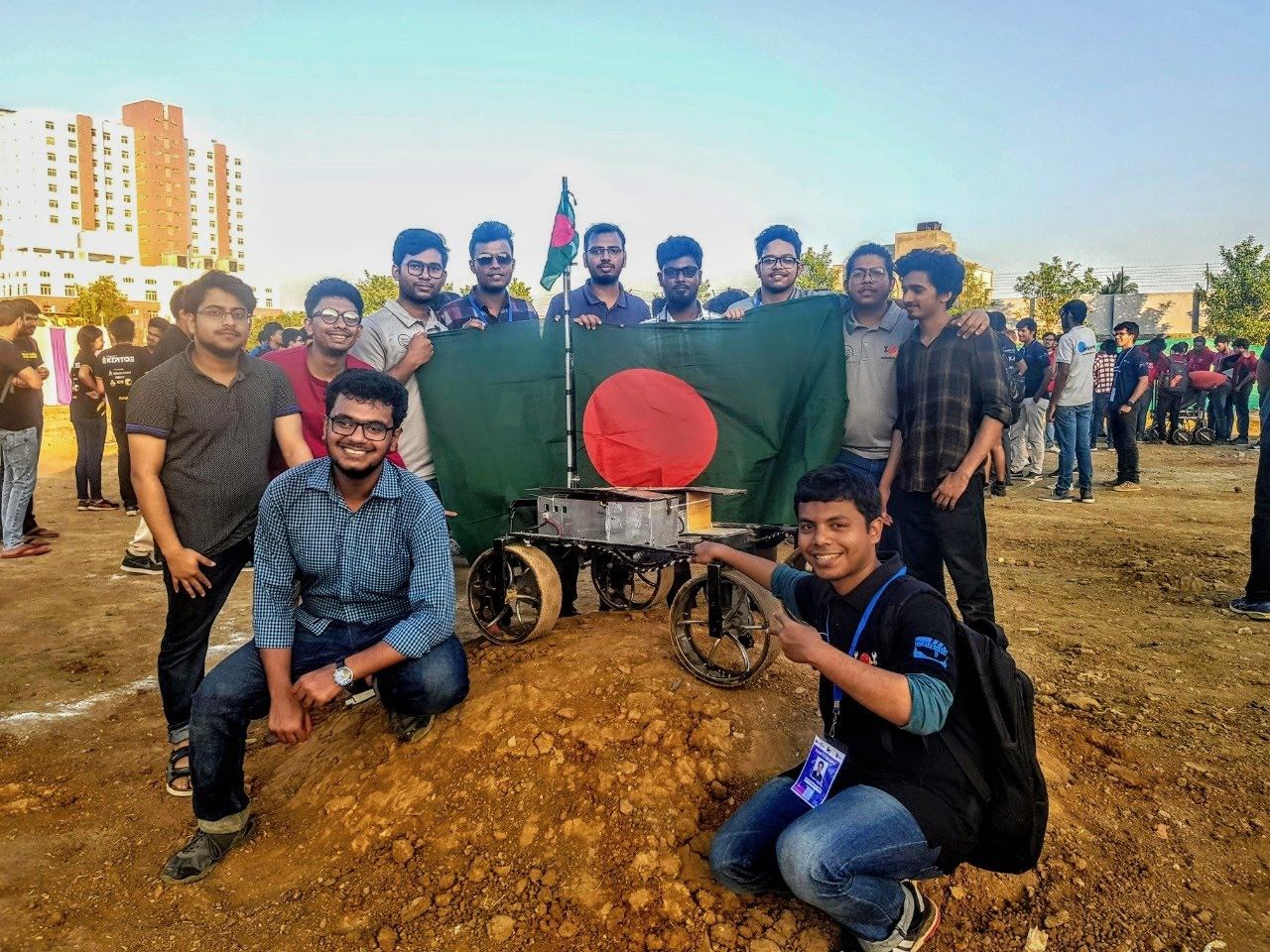 The BRACU Mongol Tori team with the rover and the Bangladesh flag at the Indian Rover Challenge 2020