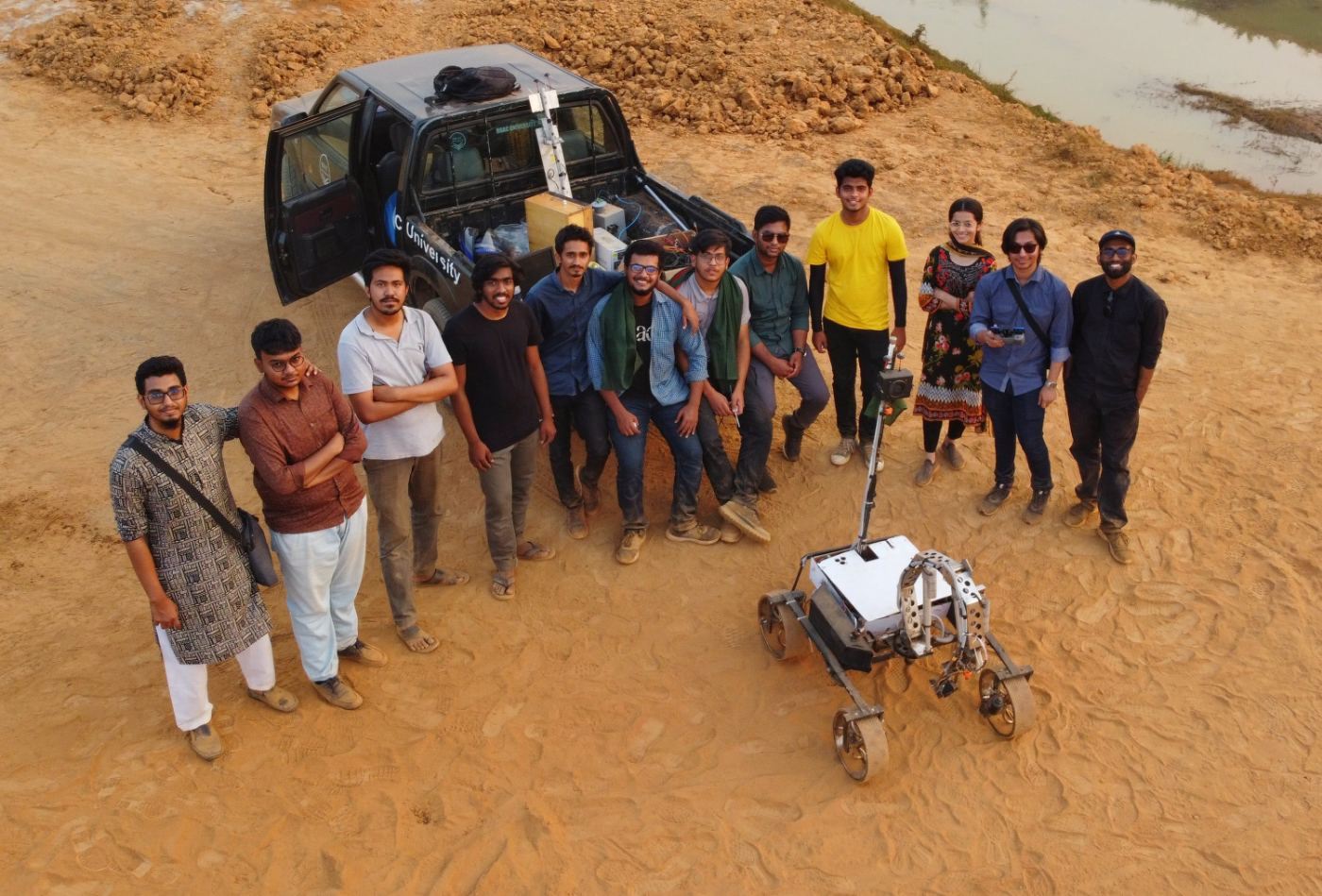 Aerial photo of the BRACU Mongol Tori team with the rover, University Rover Challenge 2020 season